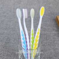 best selling adult toothbrush with colorful leaves image on handle from factory teeth brush